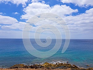 Walk along the coast between the coastal towns of Puerro del Carmen and Puerto Calero. Lanzarote, Spain photo