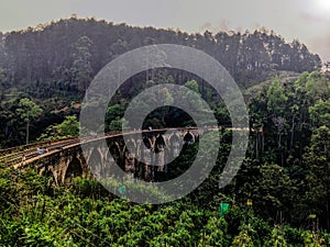 Walk along the rails on the Nine Arch Bridge in Ella