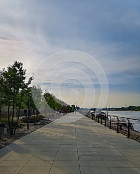 Walk by boulevard at cloudy sunny afternoon in Warsaw Vistula Boulevard