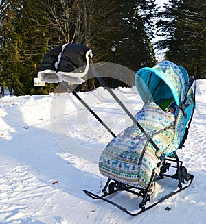 Walk on a children's sled in the winter