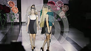 Walk defile slow motion girl colorful dress catwalk model show closeup vogue 4K. photo