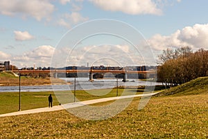 Walk with a dog at riverside park.