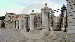 Walk next to the side facade of the royal palace of Aranjuez in the community of Madrid.