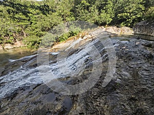 Walk through river waterfalls in Panama