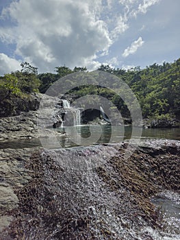 Walk through river waterfalls in Panama