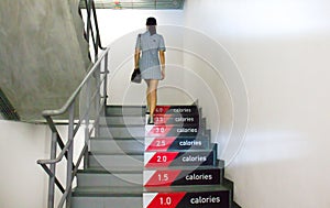 Walk up stair to lose calories. Woman