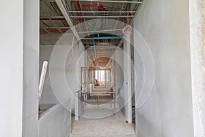 Walk way interior and scaffolding in construction building site with sun light tone