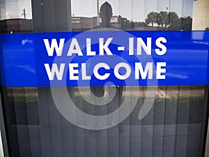 Walk In Welcome Sign in the Window of a Doctors Office