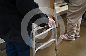 Walker being used by an elderly woman