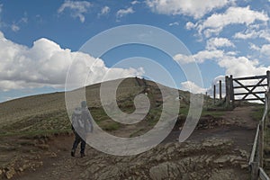 A walker heading up the Mam Tor trail in the Peak District