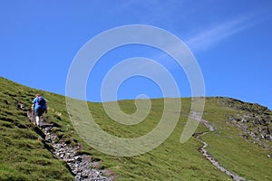 Walker hillside footpath Blencathra, Cumbria, UK