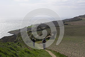 Walkers on coastal path photo