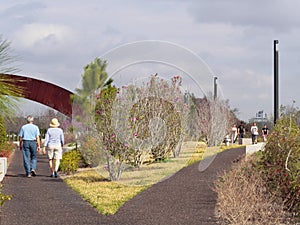 Walkers in Crescent City Park Along the Mississippi River