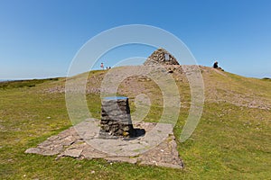 Walkers enjoying a rest in the beautiful summer weather having climbed to the top of Dunkery Hill, Somerset