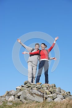 Walkers Standing On Pile Of Rocks