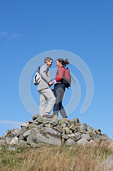 Walkers Standing On Pile Of Rocks