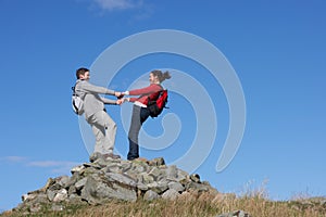 Walkers Standing On Pile Of Rocks