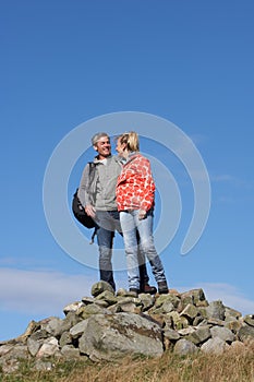 Walkers Standing On Pile Of Rocks