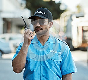 Walkie talkie, man and a security guard or safety officer outdoor on a city road with communication. Serious male person
