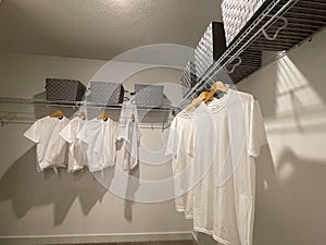 A walkin master bedroom closet in a condominium model home in Orlando, Florida