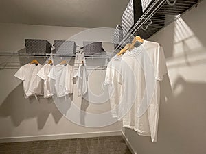 A walkin master bedroom closet in a condominium model home in Orlando, Florida