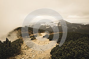 Walking above clouds in slovakian Tatra mountains - vintage retro look