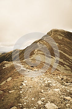 Walking above clouds in slovakian Tatra mountains - vintage retro look