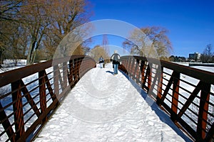 Walking Across the Snowy Bridge