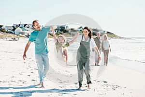 Walking, adventure and family generations on a beach together on vacation, holiday or weekend trip. Happy, travel and