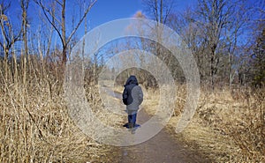 Walking alone in a deserted path