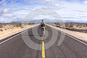 Walking alone on a lone desert highway