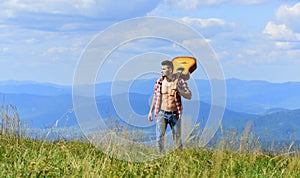 Walking alone. Man with guitar walking on top of mountain. Guy hiker enjoy pure nature. Exploring nature. Beauty of