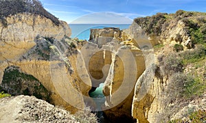 Walking along the cliffs and beach of Praia Da Coelha and Praia do Castelo in Algarve, south of Portugal