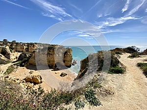 Walking along the cliffs and beach of Praia Da Coelha and Praia do Castelo in Algarve, south of Portugal