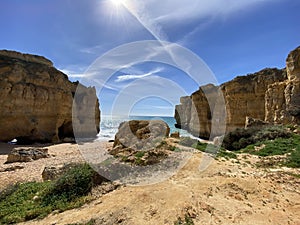 Walking along the cliffs and beach of Praia Da Coelha and Praia do Castelo in Algarve, south of Portugal