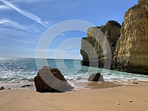 Walking along the cliffs and beach of Praia Da Coelha and Praia do Castelo in Algarve, south of Portugal