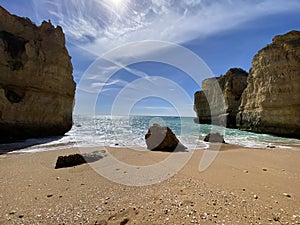 Walking along the cliffs and beach of Praia Da Coelha and Praia do Castelo in Algarve, south of Portugal