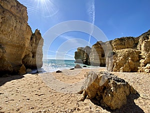 Walking along the cliffs and beach of Praia Da Coelha and Praia do Castelo in Algarve, south of Portugal