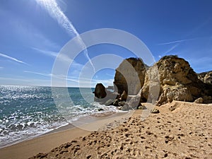 Walking along the cliffs and beach of Praia Da Coelha and Praia do Castelo in Algarve, south of Portugal