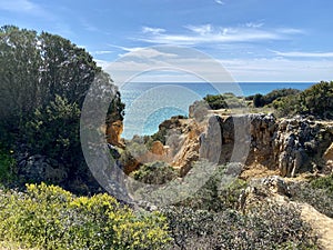 Walking along the cliffs and beach of Praia Da Coelha and Praia do Castelo in Algarve, south of Portugal