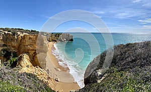 Walking along the cliffs and beach of Praia Da Coelha and Praia do Castelo in Algarve, south of Portugal