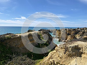 Walking along the cliffs and beach of Praia Da Coelha and Praia do Castelo in Algarve, south of Portugal