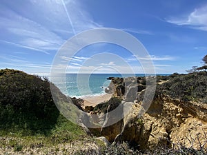 Walking along the cliffs and beach of Praia Da Coelha and Praia do Castelo in Algarve, south of Portugal