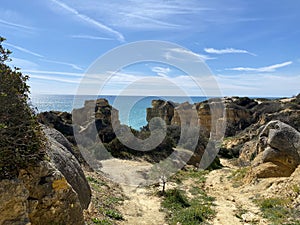 Walking along the cliffs and beach of Praia Da Coelha and Praia do Castelo in Algarve, south of Portugal