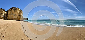 Walking along the cliffs and beach of Praia Da Coelha and Praia do Castelo in Algarve, south of Portugal