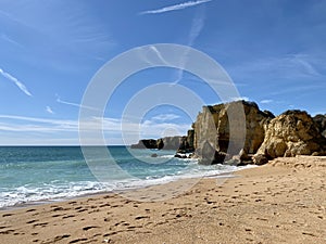 Walking along the cliffs and beach of Praia Da Coelha and Praia do Castelo in Algarve, south of Portugal