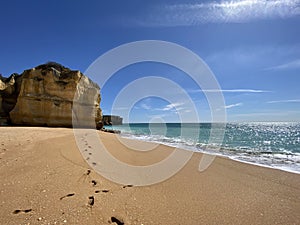 Walking along the cliffs and beach of Praia Da Coelha and Praia do Castelo in Algarve, south of Portugal