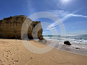 Walking along the cliffs and beach of Praia Da Coelha and Praia do Castelo in Algarve, south of Portugal