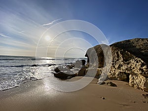 Walking along the sandy beach of Praia Da Gale in Algarve, south of Portugal