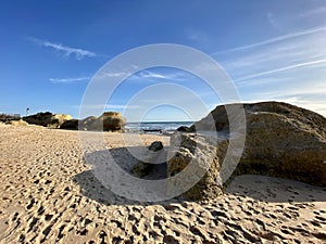 Walking along the sandy beach of Praia Da Gale in Algarve, south of Portugal